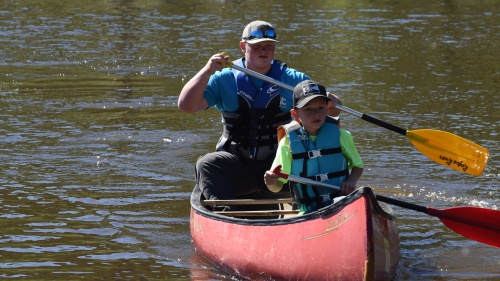 two boys in a canoe