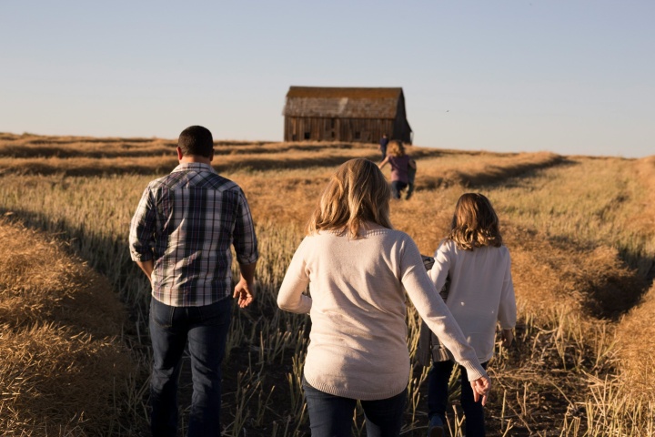 A family walking through a field.