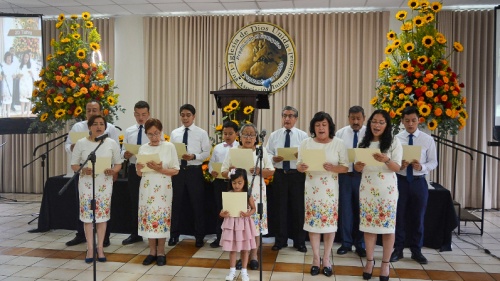 a choir singing while wearing coordinating clothes