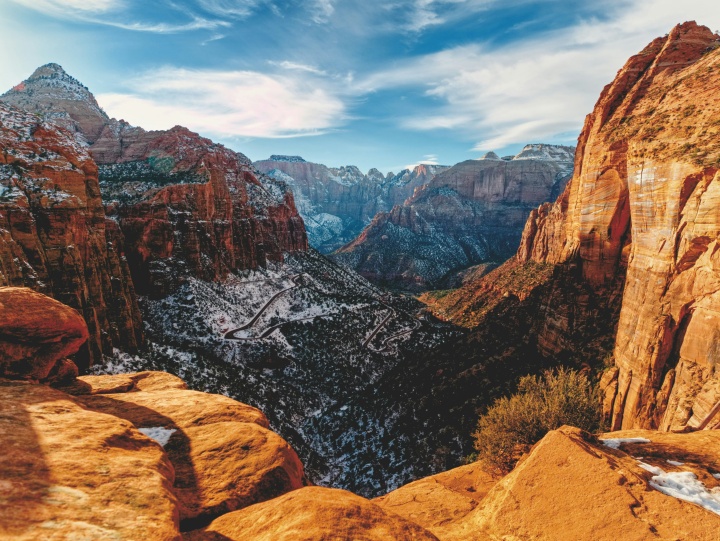 a mountainous landscape filled with red rock structures