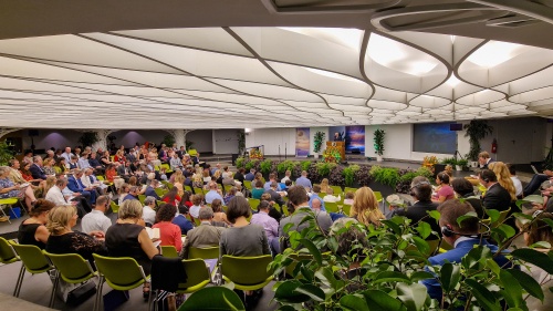 a group of people seated in an auditorium