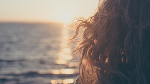 A woman looking out on the ocean.